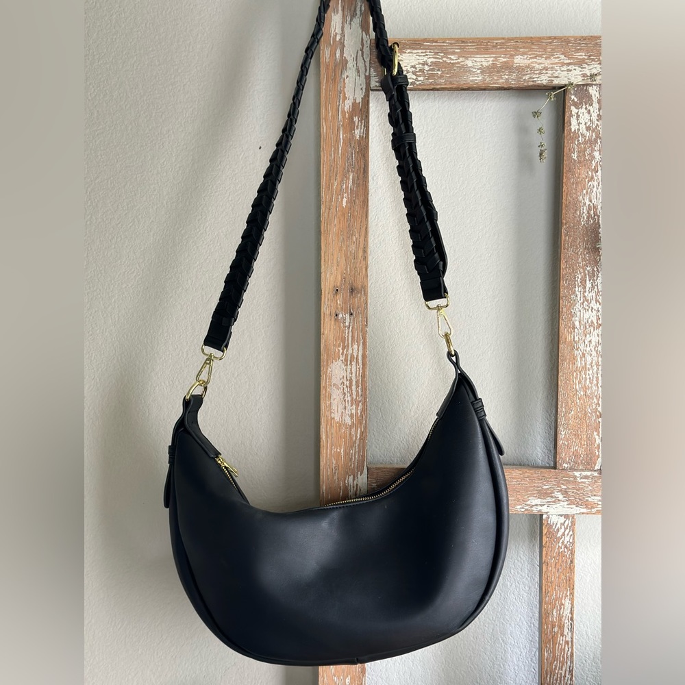 Jules Kae moon shaped black Zola bag.